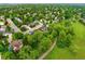 Aerial view of a suburban neighborhood with tree-lined streets and well-maintained homes at 930 W Dry Creek Rd, Littleton, CO 80120