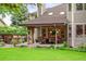 A well-maintained backyard featuring a cozy outdoor seating area and a lush green lawn at 930 W Dry Creek Rd, Littleton, CO 80120