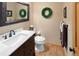 Well-maintained bathroom with a modern sink, vanity, toilet, and stylish decor, offering a clean and functional space at 930 W Dry Creek Rd, Littleton, CO 80120