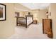 Basement bedroom featuring a log bed, rustic nightstand, and neutral décor at 930 W Dry Creek Rd, Littleton, CO 80120