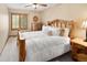 Cozy bedroom featuring a log bed frame and matching furniture at 930 W Dry Creek Rd, Littleton, CO 80120