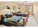 Neutral bedroom features two beds with log frames and matching bear-themed bedding at 930 W Dry Creek Rd, Littleton, CO 80120