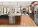 Open kitchen with granite countertops, stainless appliances, and seamless flow into the living area at 930 W Dry Creek Rd, Littleton, CO 80120