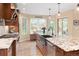 Spacious kitchen with granite countertops, a large island and a window bench at 930 W Dry Creek Rd, Littleton, CO 80120