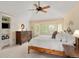 Charming main bedroom features white walls, a ceiling fan and a bay window at 930 W Dry Creek Rd, Littleton, CO 80120