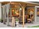 Relaxing covered patio with stylish seating, wood accents, and outdoor ambiance at 930 W Dry Creek Rd, Littleton, CO 80120