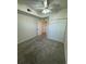 Neutrally decorated bedroom featuring carpet, large closet and nearby doors at 17346 Nature Walk Trail Trl # 105, Parker, CO 80134