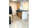 Open kitchen featuring tile floors, a breakfast bar, and stainless steel appliances at 17346 Nature Walk Trail Trl # 105, Parker, CO 80134