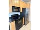 Kitchen featuring stainless steel appliances, granite counters, and natural wood cabinets at 17346 Nature Walk Trail Trl # 105, Parker, CO 80134