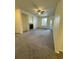 Bright living room with a cozy fireplace, ceiling fan, and access to outdoor balcony at 17346 Nature Walk Trail Trl # 105, Parker, CO 80134