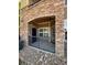 Covered patio with stone archway and wrought iron railing at 17346 Nature Walk Trail Trl # 105, Parker, CO 80134