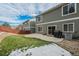 Spacious backyard with a patio, grassy area, and privacy fence at 2389 Quartz St, Castle Rock, CO 80109