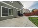 Spacious backyard patio, perfect for outdoor entertaining, with adjacent grass area at 2389 Quartz St, Castle Rock, CO 80109
