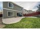 Private backyard with patio and grass at 2389 Quartz St, Castle Rock, CO 80109