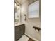 Small bathroom with gray vanity and white towels at 2389 Quartz St, Castle Rock, CO 80109