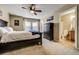 Spacious bedroom with ensuite bathroom and ceiling fan at 2389 Quartz St, Castle Rock, CO 80109