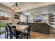 Dining area with wooden table and access to backyard at 2389 Quartz St, Castle Rock, CO 80109