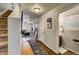 Bright entryway with stairs, half bath, and views to living room at 2389 Quartz St, Castle Rock, CO 80109