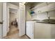 Laundry room with washer, dryer, and shelving at 2389 Quartz St, Castle Rock, CO 80109