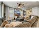 Open concept living room with sectional sofa and large TV at 2389 Quartz St, Castle Rock, CO 80109