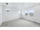 Comfortable bedroom with carpeted floors and large windows that provide natural light at 39732 Penn Rd, Elizabeth, CO 80107
