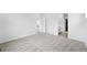 Spacious bedroom with plush carpeting and easy access to a full bathroom at 39732 Penn Rd, Elizabeth, CO 80107