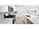 Stylish kitchen featuring stainless steel appliances, a center island, and modern fixtures at 39732 Penn Rd, Elizabeth, CO 80107