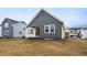 New home with gray siding and white trim on a spacious lot at 39732 Penn Rd, Elizabeth, CO 80107