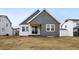 New construction home with gray siding and white trim on a large lot at 39732 Penn Rd, Elizabeth, CO 80107