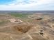 Aerial view of the area showcasing open land and the proximity to other developments at 22990 County Road 30, Hudson, CO 80642