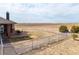Fenced backyard with a stone patio, perfect for outdoor living and entertaining at 22990 County Road 30, Hudson, CO 80642