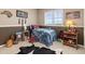 Cozy bedroom with cowhide rug, playful decor, and comfortable sleeping space at 22990 County Road 30, Hudson, CO 80642