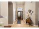 Elegant foyer featuring wood floors, a chandelier, and decorative wall art at 22990 County Road 30, Hudson, CO 80642