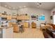 Bright kitchen with custom cabinets, a central island, and a cozy breakfast nook at 22990 County Road 30, Hudson, CO 80642