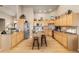 Spacious kitchen featuring custom cabinets, a central island, and modern appliances at 22990 County Road 30, Hudson, CO 80642