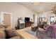 Inviting living room featuring comfortable seating, hardwood floors, and stylish decor at 22990 County Road 30, Hudson, CO 80642