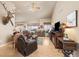 Spacious living room with vaulted ceilings, comfortable seating, and natural light at 22990 County Road 30, Hudson, CO 80642