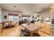 Open floor plan seamlessly connects the kitchen, dining area, and living room with ample natural light at 22990 County Road 30, Hudson, CO 80642