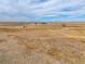 Areal view of the property with mountain views in the distance on a sunny day at 22990 County Road 30, Hudson, CO 80642
