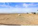 Exterior shot showcases the property, including plains and distant mountain views at 22990 County Road 30, Hudson, CO 80642