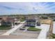 Aerial view of the gray two-story home with a meticulously landscaped yard and long driveway at 4532 Dewey Ln, Brighton, CO 80603