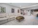 Finished basement with a large sofa and entertainment area, perfect for Gathering gatherings at 4532 Dewey Ln, Brighton, CO 80603