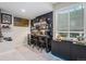 Basement with a stylish bar featuring ample storage, seating, and modern finishes at 4532 Dewey Ln, Brighton, CO 80603