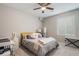 Cozy bedroom with natural light, plush carpet, and a ceiling fan, offering a comfortable space at 4532 Dewey Ln, Brighton, CO 80603
