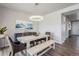 Elegant dining room with a modern chandelier and stylish decor, perfect for entertaining at 4532 Dewey Ln, Brighton, CO 80603