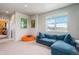 Bright loft featuring comfortable seating, movie posters, and a large window at 4532 Dewey Ln, Brighton, CO 80603