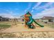Neighborhood playground with swings, slide, and a secure play area for outdoor fun at 4532 Dewey Ln, Brighton, CO 80603