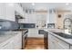 Modern kitchen with marble countertops, stainless steel appliances, and custom cabinetry at 5385 Warrior St, Frederick, CO 80504