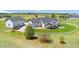 Aerial view of the property featuring the home, detached garage, expansive yard, and surrounding landscape at 3047 Deer Creek Ranch Loop, Parker, CO 80138