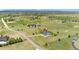 Aerial view of a home nestled on a sprawling lot in a serene countryside setting at 3047 Deer Creek Ranch Loop, Parker, CO 80138